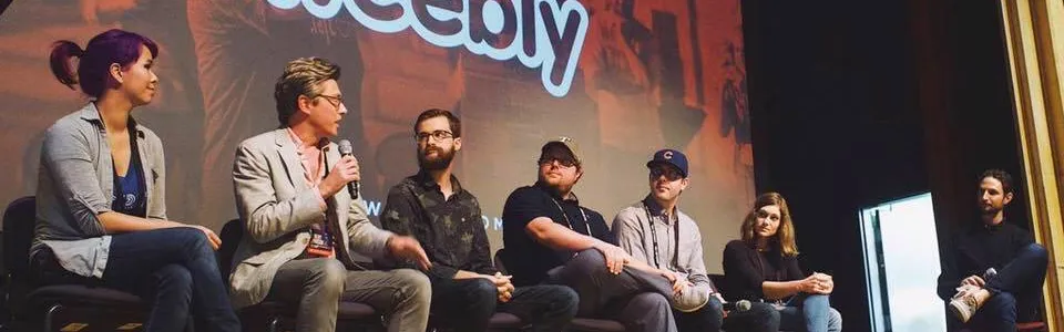 Kelly on a panel during Squares Conference