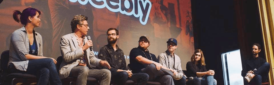 Kelly on a panel during Squares Conference